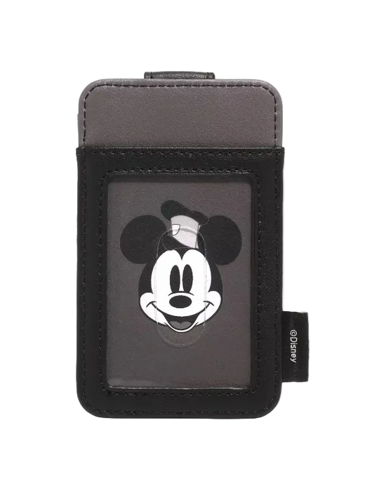 A Disney Mickey Mouse card holder wallet in black and gray faux leather, featuring a large graphic of Mickey's face on the front and a small black tag with the Disney logo on the side.