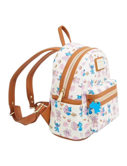 A small white backpack with a colorful cartoon character print, brown faux-leather trim, and gold-tone zippers, shown on a clean white background.