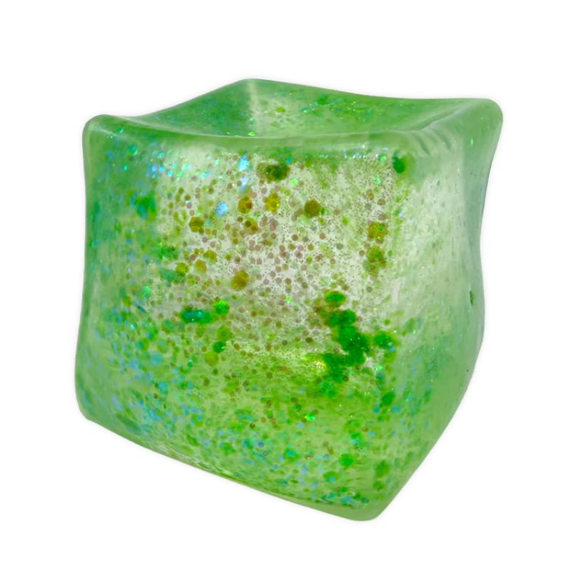 Green textured cube with speckles on a white background