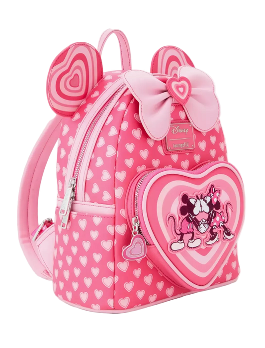 Pink backpack with heart design and Minnie Mouse illustration on a white background