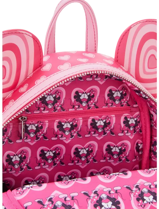 Pink backpack with cartoon character pattern on a white background