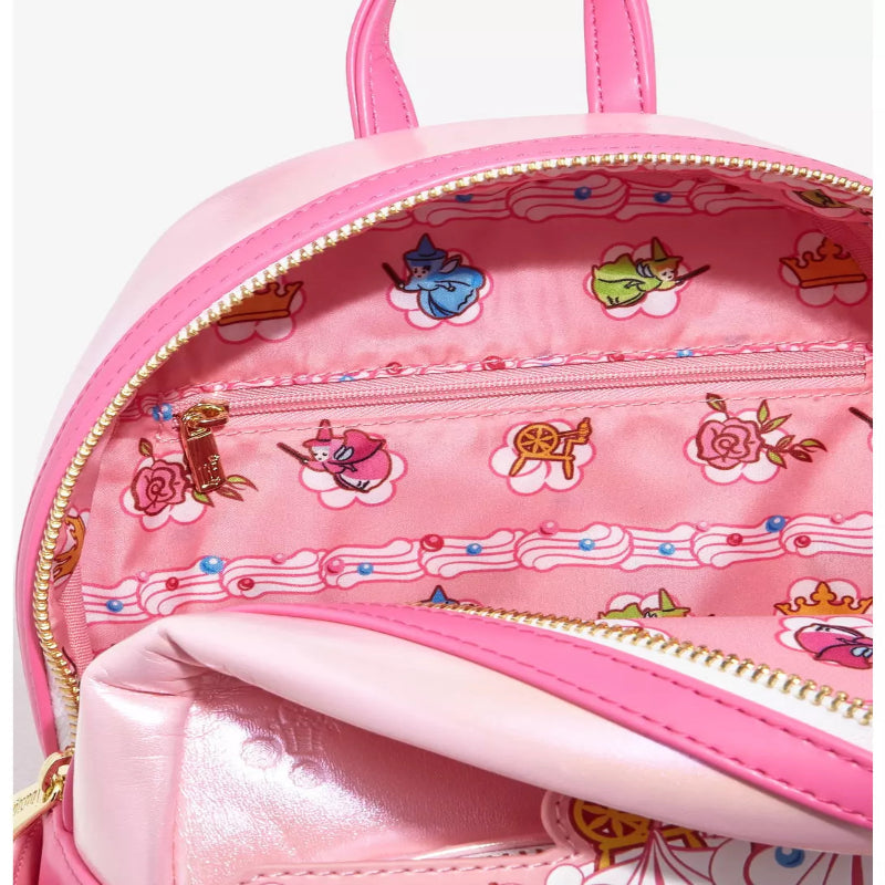 Pink backpack with decorative patterns on a white background