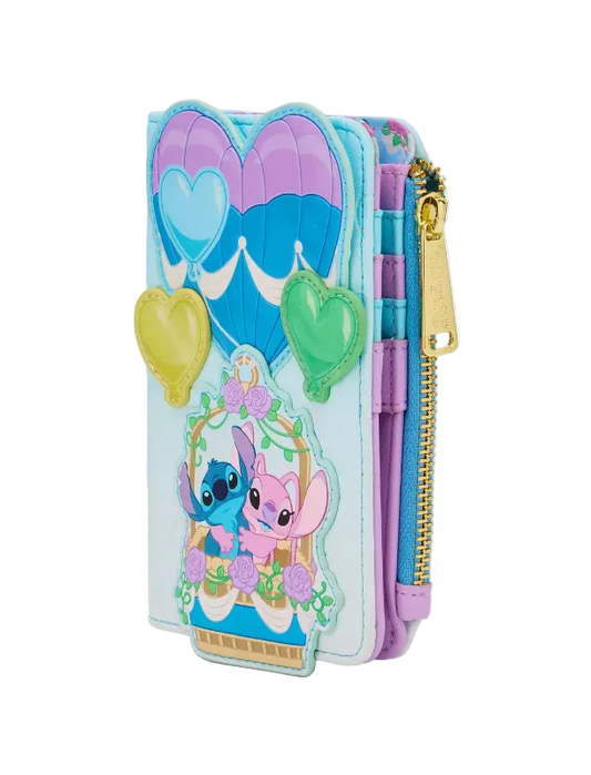 A light blue zip-around wallet featuring Stitch and Angel from Lilo & Stitch, decorated with purple and blue hot air balloons, heart-shaped charms, and a gold zipper.