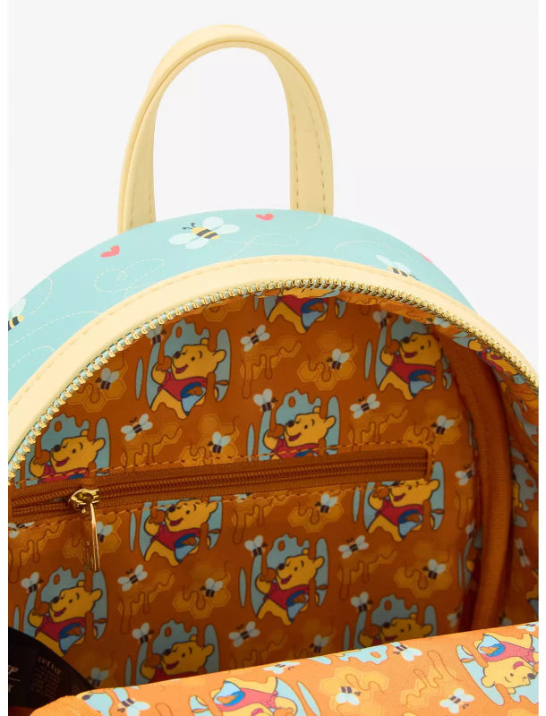 Backpack with cartoon character pattern on a light blue background