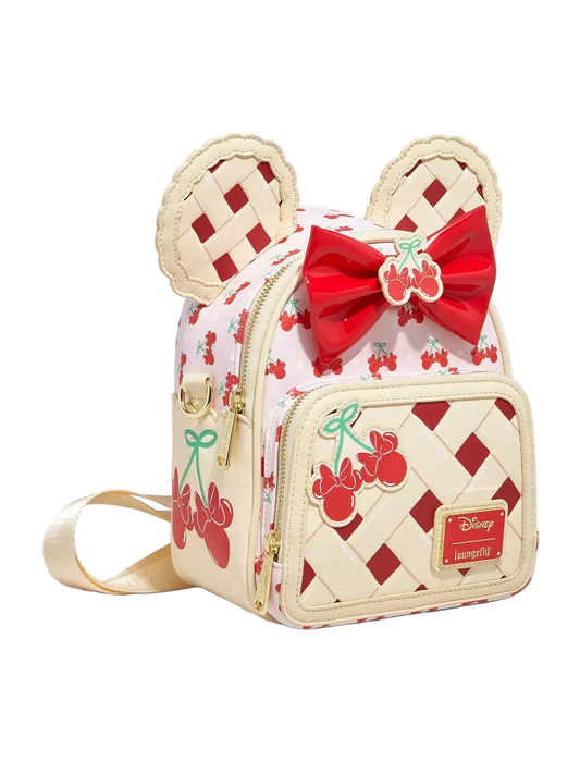 Backpack with cherry pie design and bow detail on a white background
