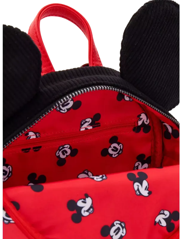 Close-up of a red backpack with black mouse ears and a black-and-white Mickey Mouse face print on the interior and exterior.