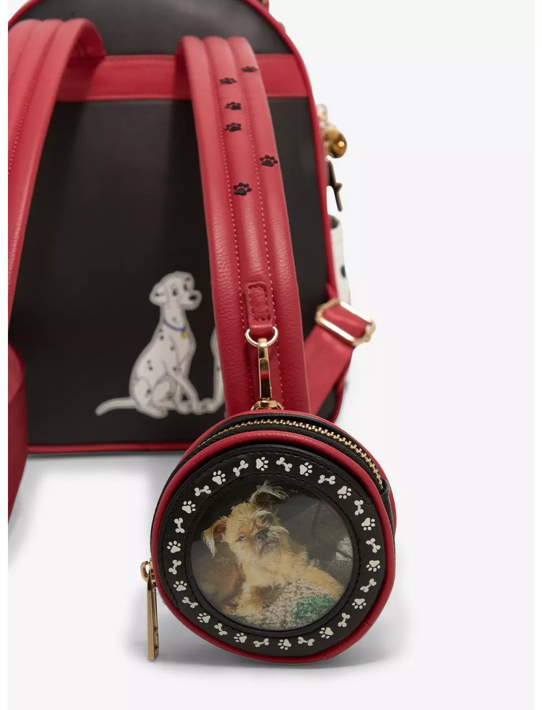 Red backpack with a small round pouch featuring a dog illustration on a white background