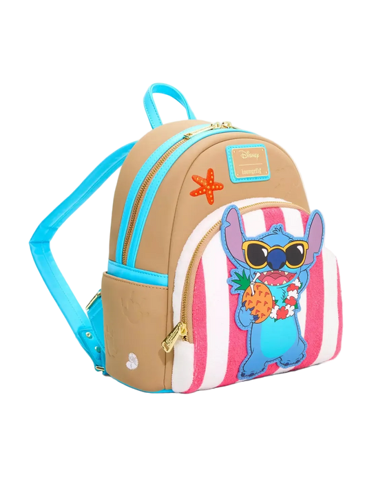 A small tan and pink striped backpack with bright blue straps and trim, gold zippers, a starfish patch, and a cartoon character applique on the front pocket.