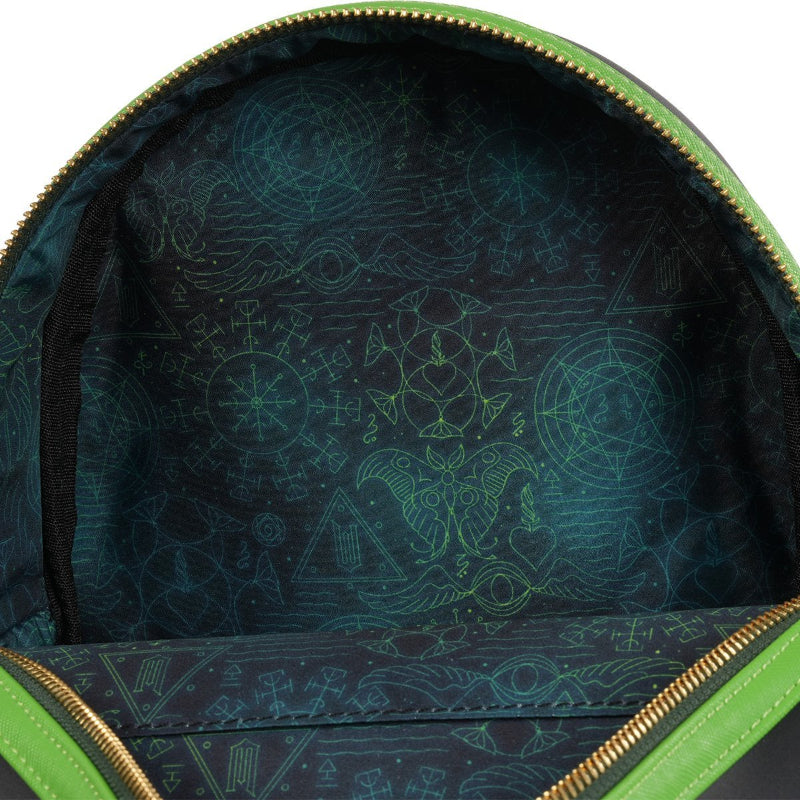 Close-up of a green backpack with a patterned interior on a white background