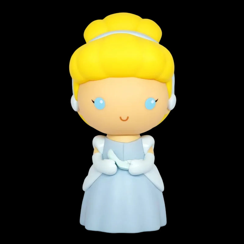 Toy figure of a character with blonde hair and blue eyes, wearing a light blue dress on a white background.