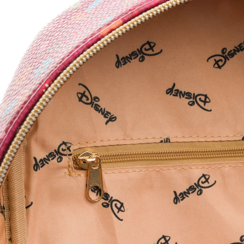 Close-up of a pink and beige bag with Disney logo on the interior.