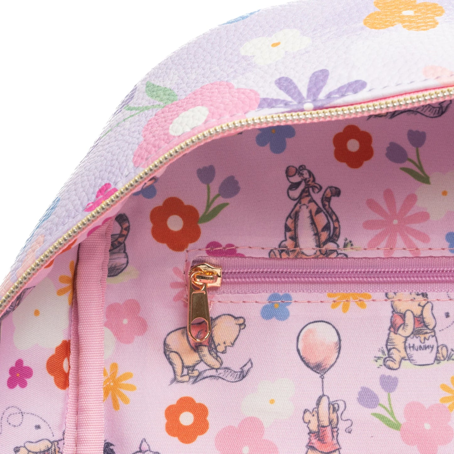 Pink floral-patterned bag with cartoon characters on a white background
