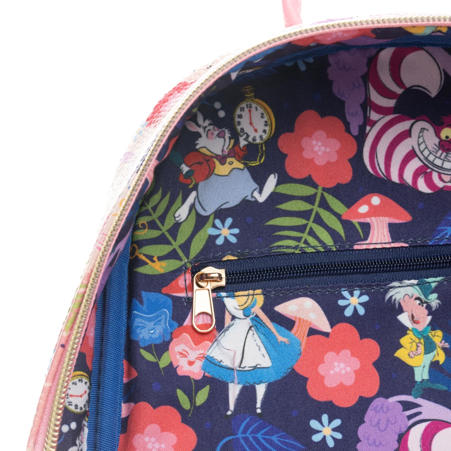 Backpack with Alice in Wonderland design featuring characters and flowers on a dark blue background.