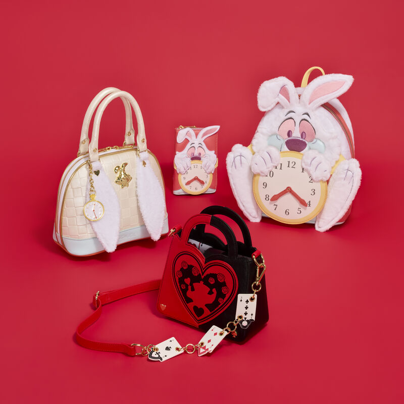 Three handbags and a clock with cartoon character on a red background