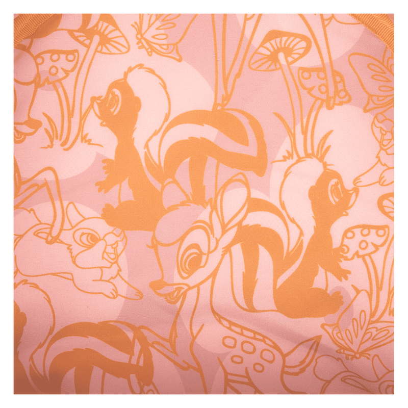 Patterned fabric with orange outlines of animals and plants on a pink background