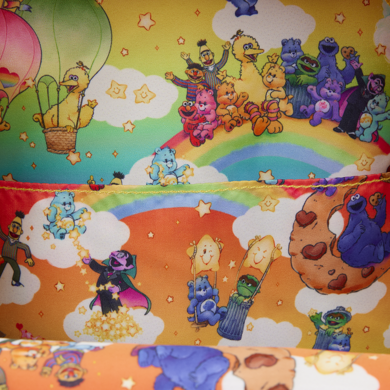 Colorful children's fabric with Sesame Street characters and a rainbow.