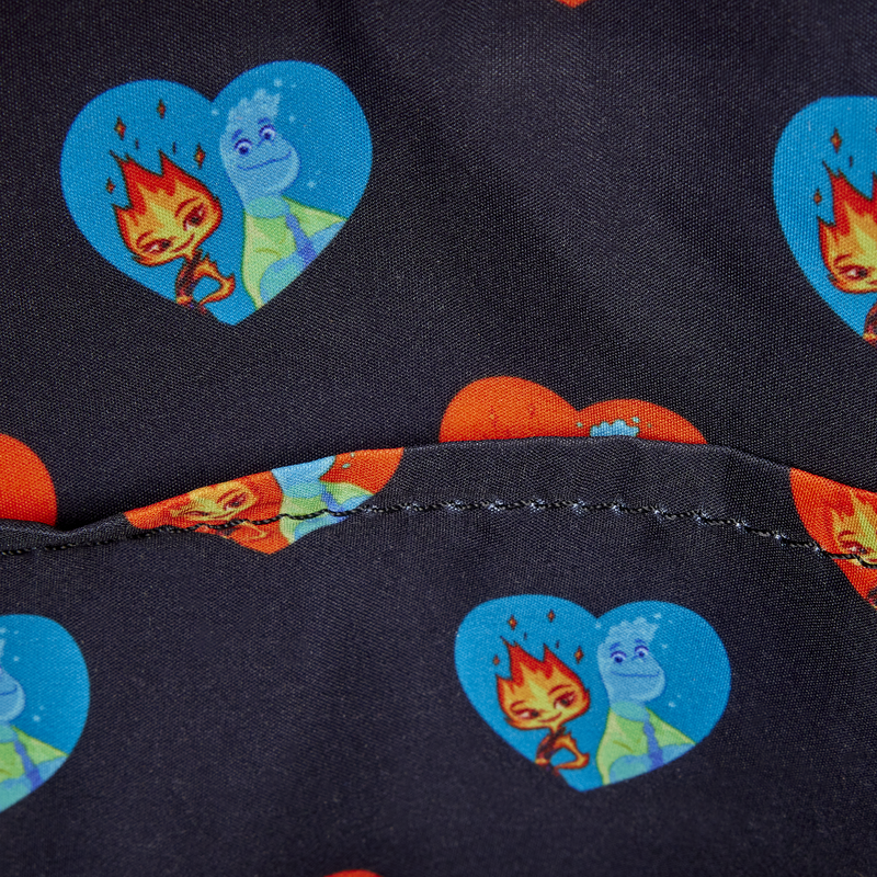 Close-up of a fabric with cartoon character heart designs on a dark background