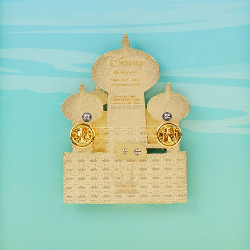 Gold jewelry box with two gold rings on a light blue background