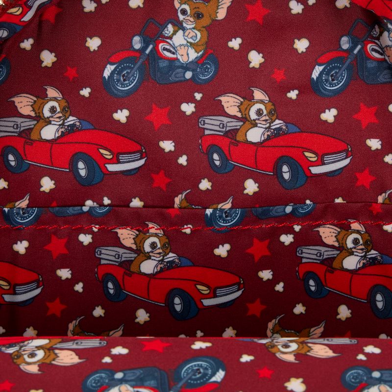 Patterned fabric with cartoon characters in cars and motorcycles on a red background
