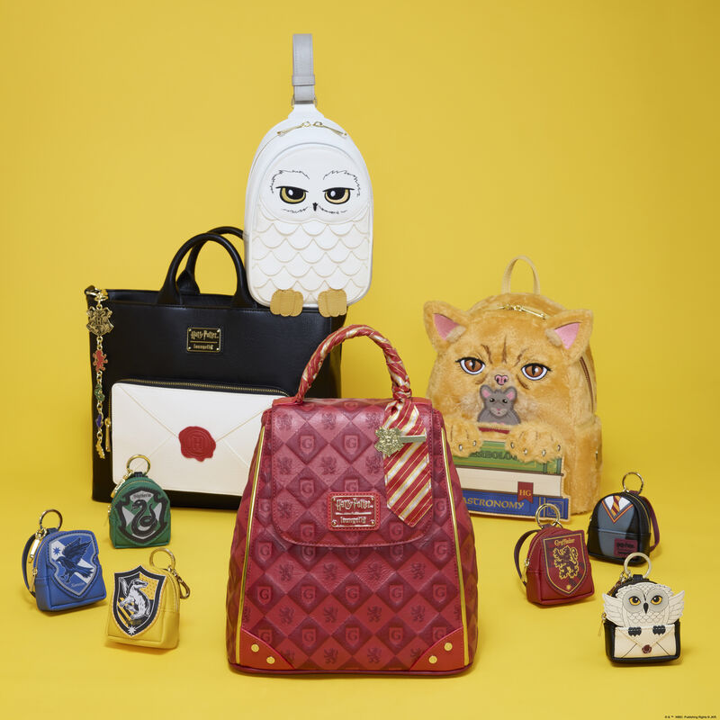Collection of themed bags and keychains on a yellow background