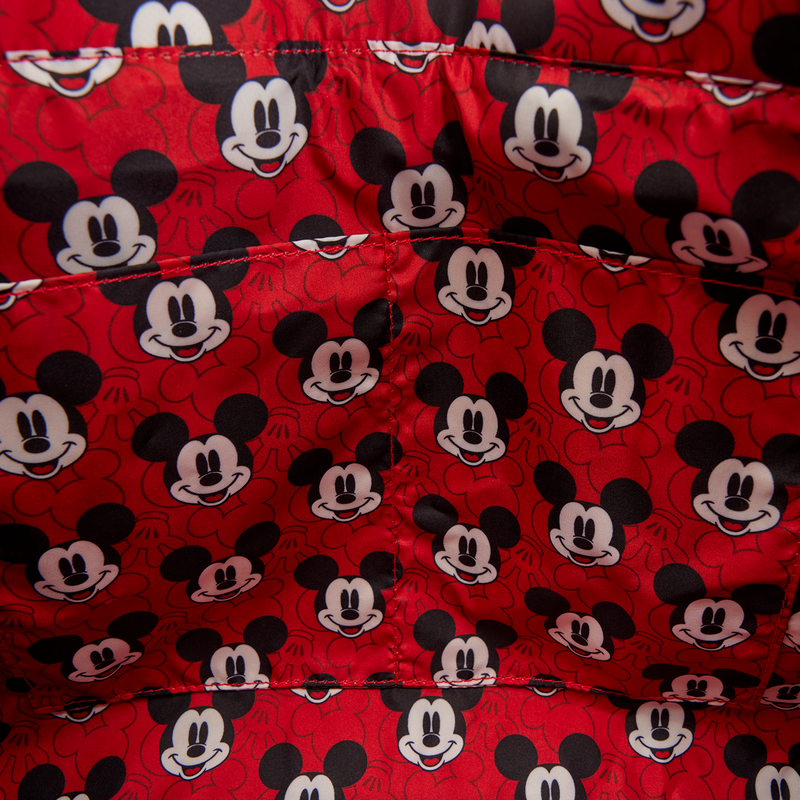 Red fabric with multiple Mickey Mouse faces printed on it