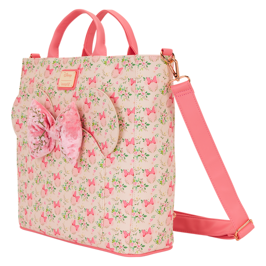 Pink floral backpack with a bow on a white background