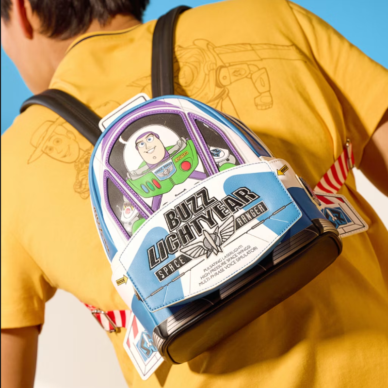 Person wearing a Buzz Lightyear backpack with a blue sky background