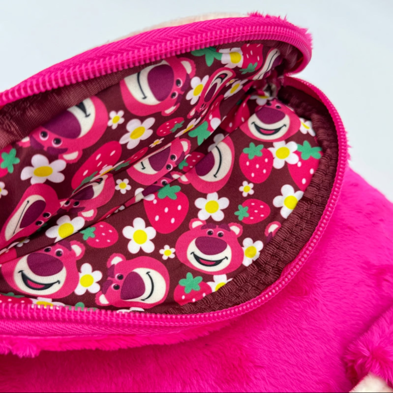 Pink pouch with cartoon animal pattern on a white background