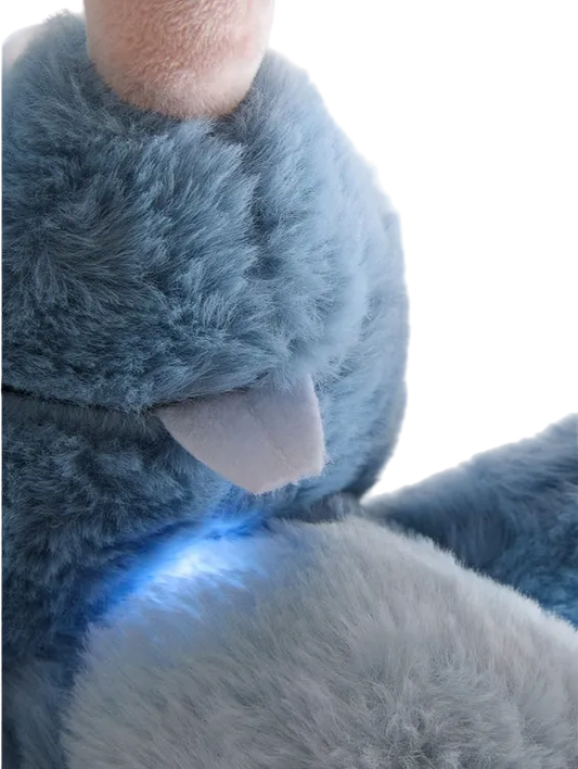 Close-up of a blue plush toy with a blurred background