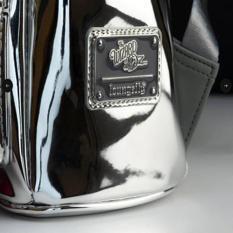 Metallic surface with a 'The Wizard of Oz' loungefly logo