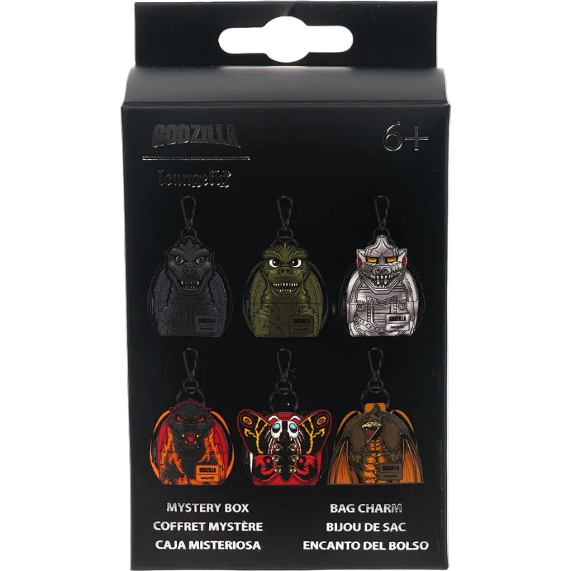 Packaging of Godzilla collectible keychains with various designs on a black background.