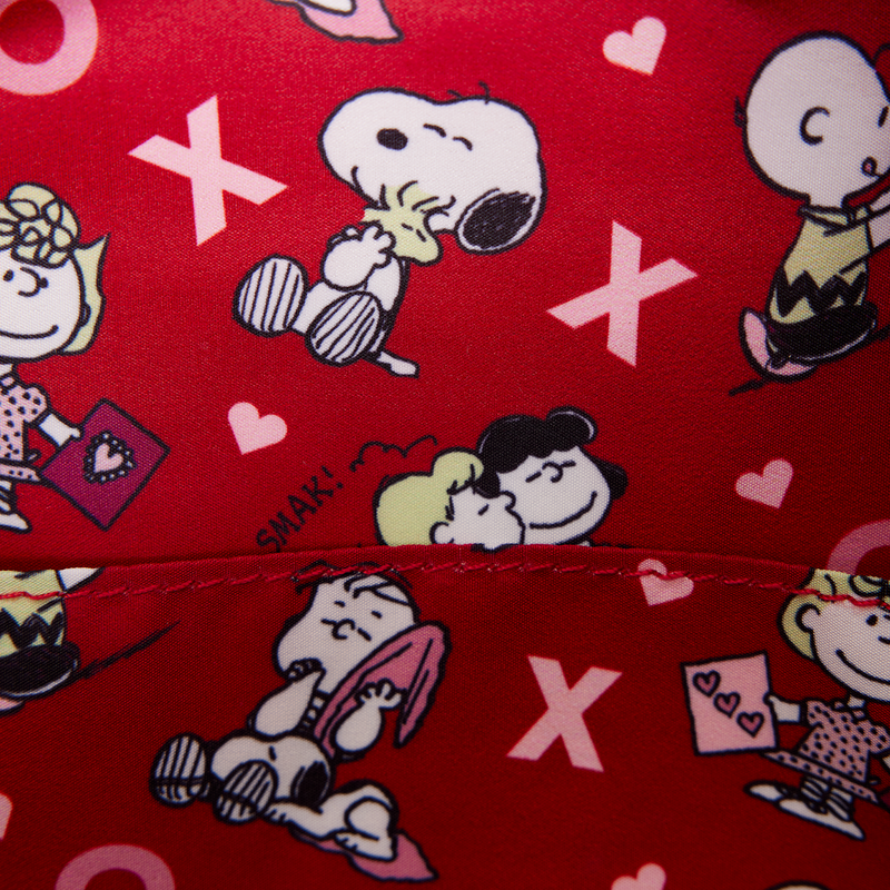 Red fabric with cartoon characters and 'XOXO' patterns