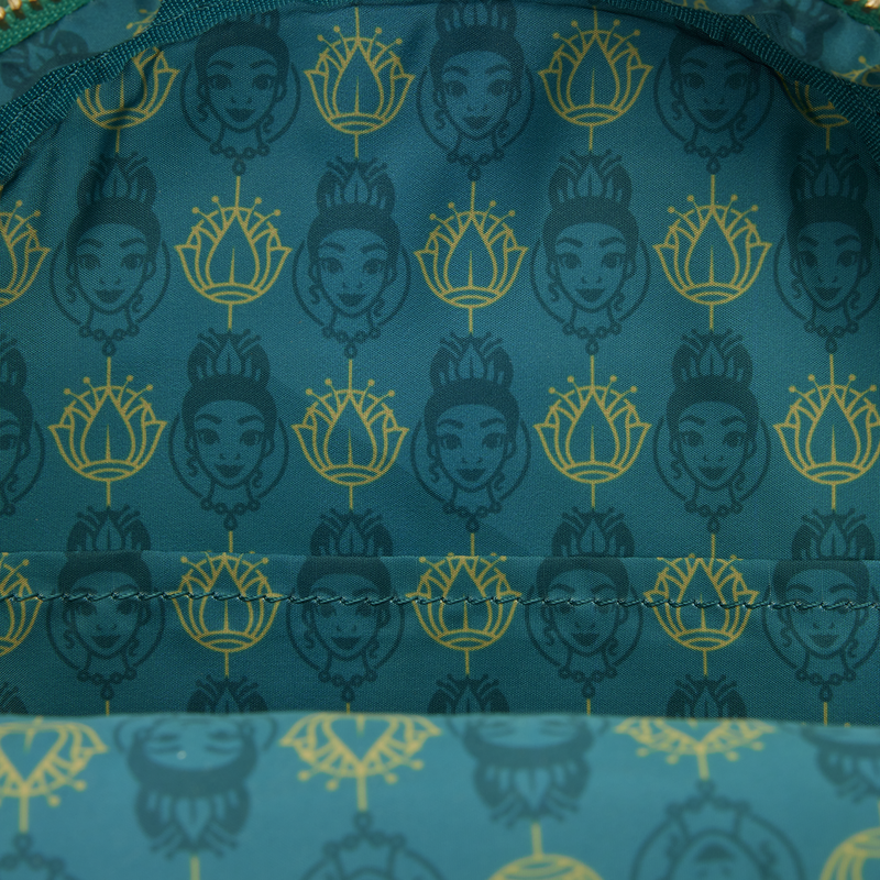 Patterned fabric with faces and floral designs on a blue background