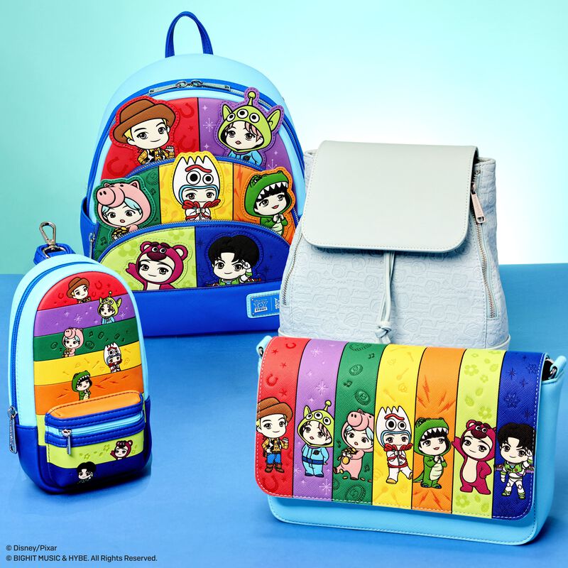 Colorful backpack and pouch with cartoon character design on a blue background