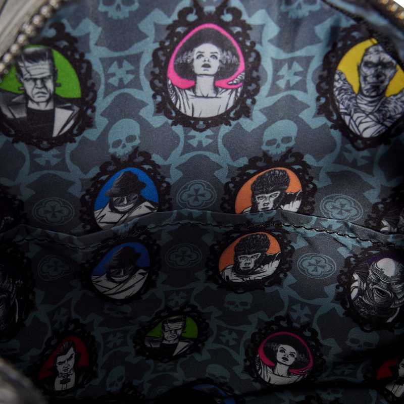Close-up of a patterned fabric with character illustrations on a dark background