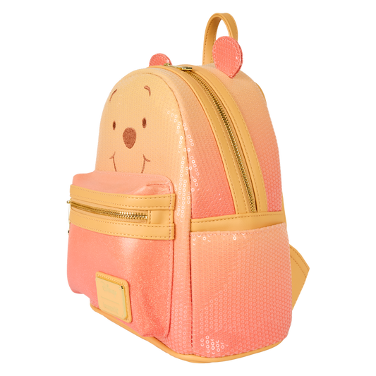 Pink and yellow backpack with bear face design on a white background