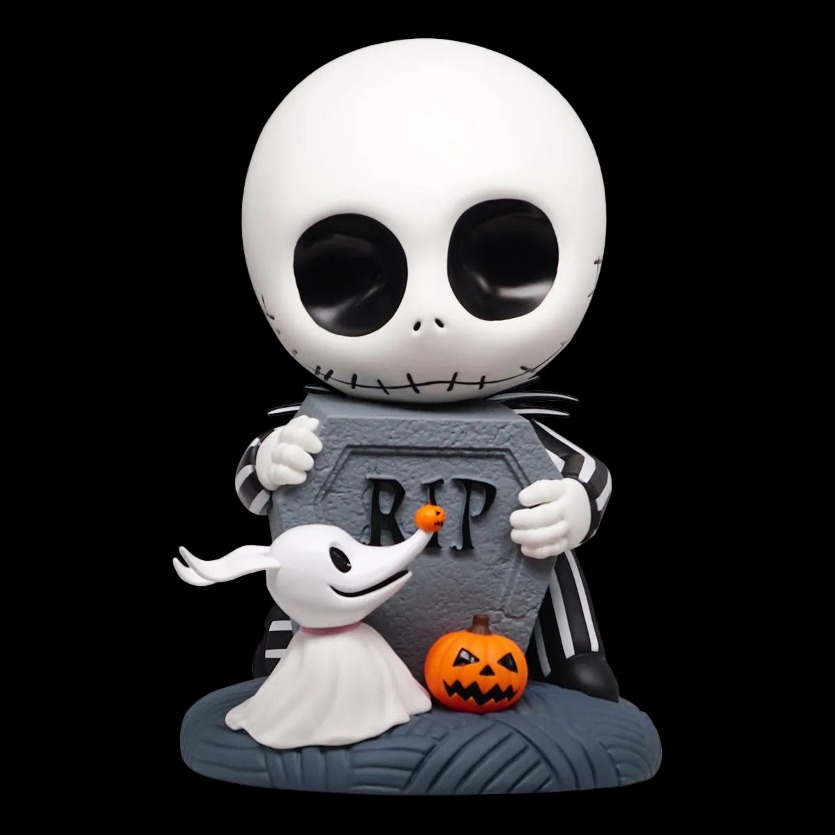 Cartoon character with a white skull holding a ghost and pumpkin near a tombstone.