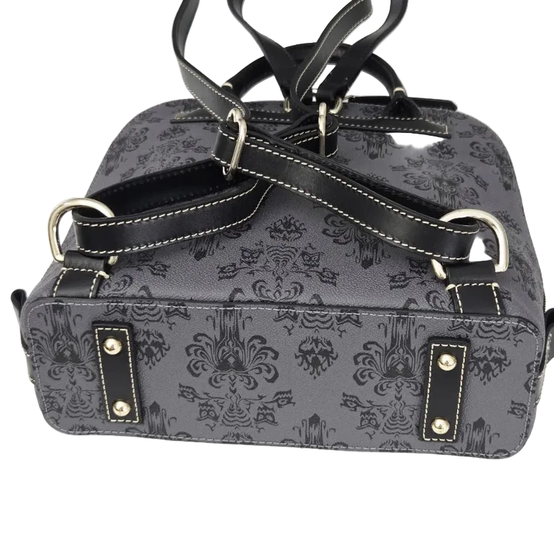 A dark gray and black damask-patterned handbag with black leather straps, silver-tone metal hardware, and white contrast stitching, shown against a plain white background.