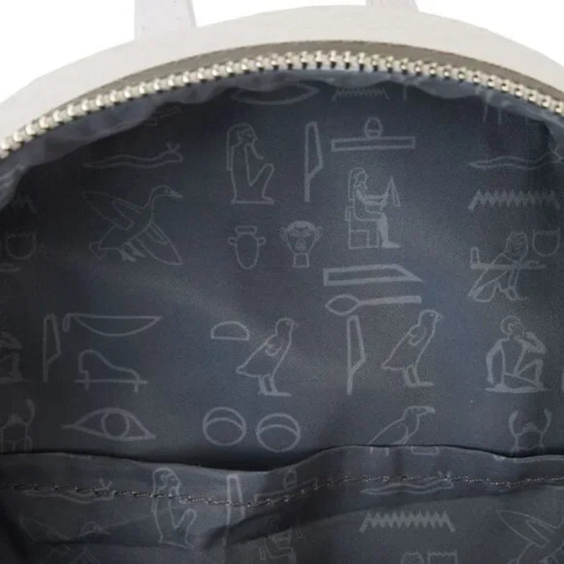 Navy blue bag interior with white hieroglyphic patterns on a white background