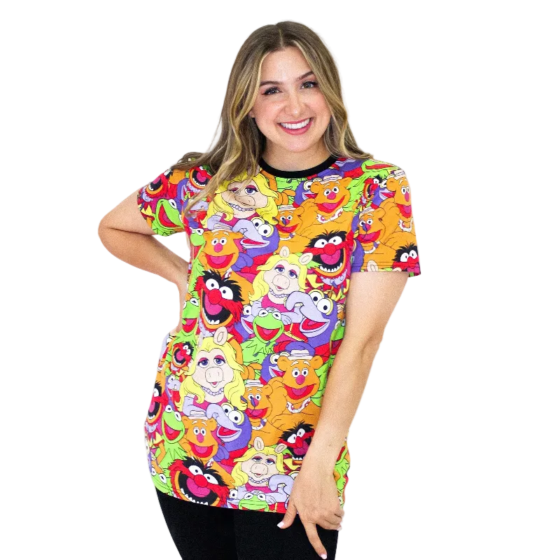 Woman wearing a colorful t-shirt with cartoon character pattern on a white background