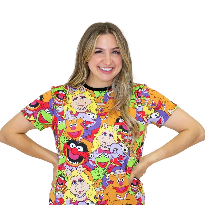 Person wearing a colorful shirt with cartoon character print on a white background