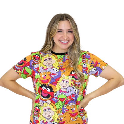 Person wearing a colorful shirt with cartoon character print on a white background