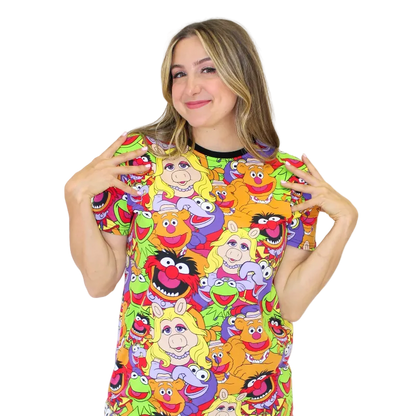 Woman wearing a colorful t-shirt with cartoon character design on a white background