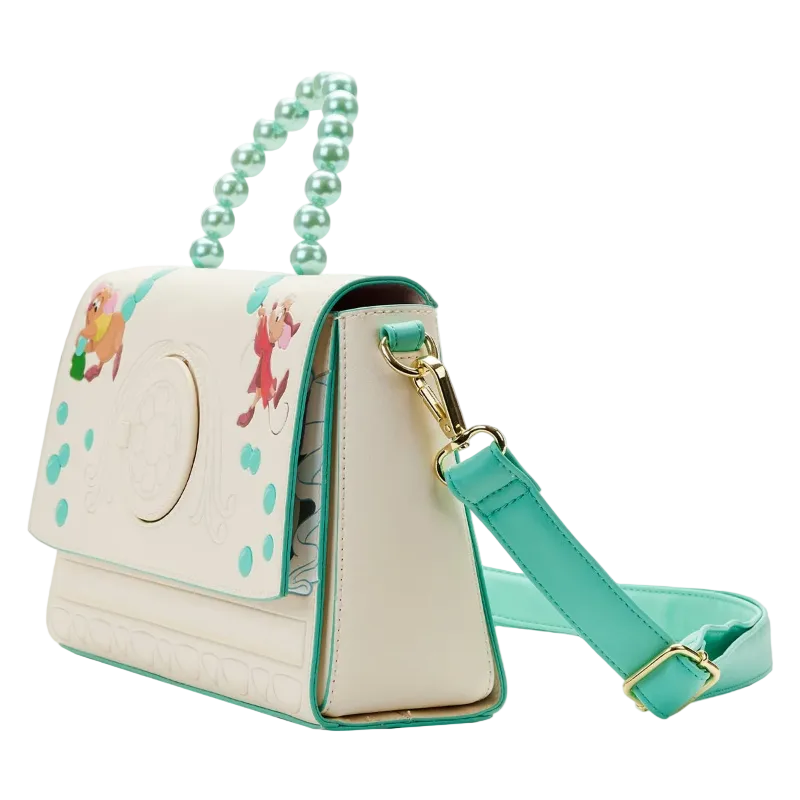 Beige handbag with green strap and handle on a white background