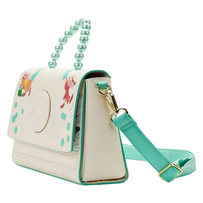 Beige handbag with green strap and handle on a white background