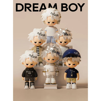 Collection of 'Dream Boy' figurines with various outfits on a beige background