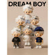 Collection of 'Dream Boy' figurines with various outfits on a beige background