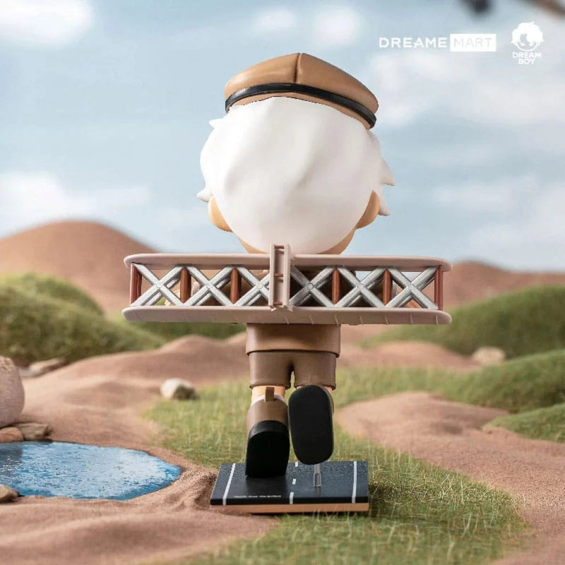 Figurine of a character with a plane on a desert landscape background