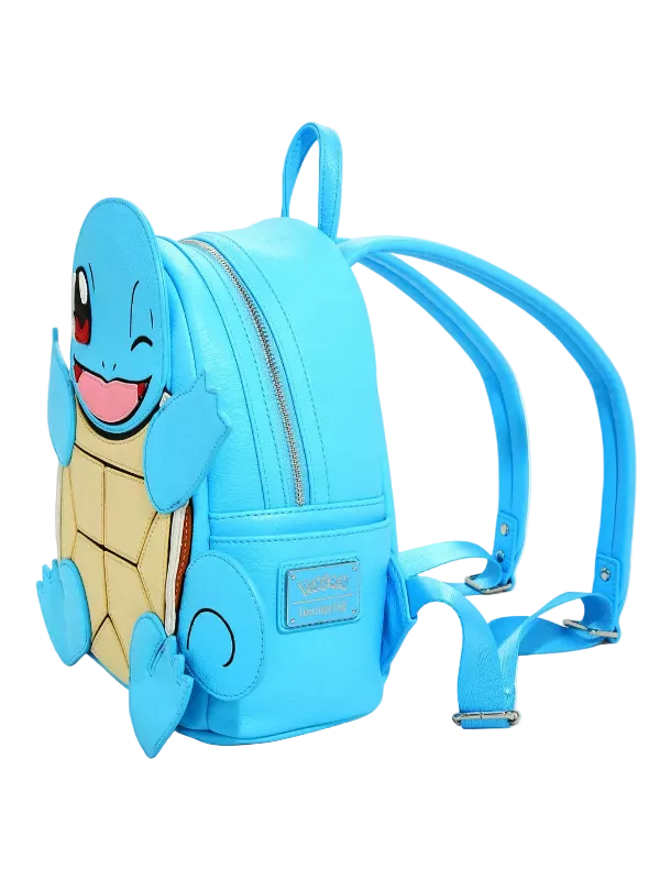 A light blue faux-leather backpack featuring a 3D Squirtle character design on the front, complete with a smiling face, winking eye, and beige shell pattern. The backpack has two adjustable shoulder straps and a top carry handle, photographed on a clean white background.