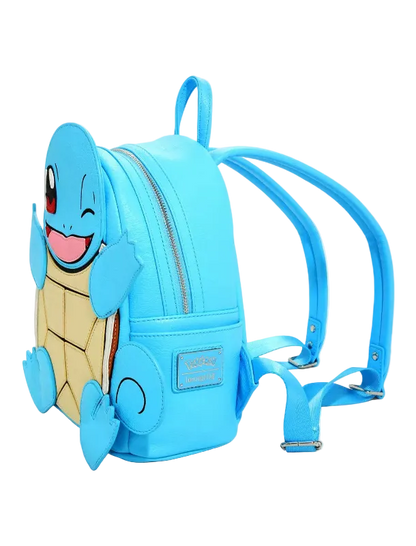 A light blue faux-leather backpack featuring a 3D Squirtle character design on the front, complete with a smiling face, winking eye, and beige shell pattern. The backpack has two adjustable shoulder straps and a top carry handle, photographed on a clean white background.